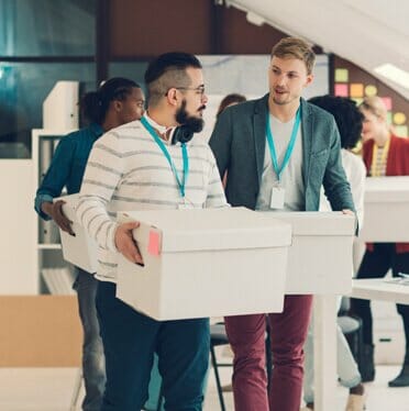 Business Men Moving Boxes